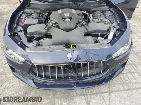 2018 Maserati Ghibli z VIN ZAM57XSA5J1287424, wystawiony jako Copart lot #71215154 z przebiegiem 20 029 mil mil oraz Szkoda całkowita • Salvage title. Historia ofert i sprzedaży dostępna na DreamBid. Obrazek 11.