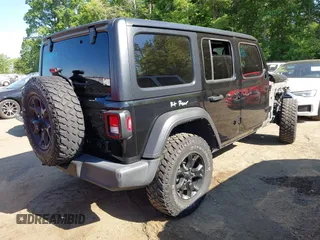 2021 Jeep Wrangler Unlimited Sport S with VIN 1C4HJXDNXMW646194, listed as a IAAI auction lot 42243169 with 44,237 mi miles and . Bid and sale history available at DreamBid. Image 4.