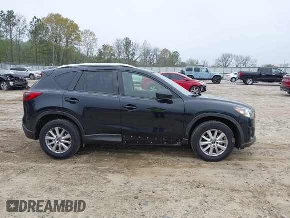 2014 Mazda CX-5 Touring with VIN JM3KE2CY7E0341658, listed as a IAAI auction lot 41915807 with 99,287 mi miles. Bid and sale history available at carsss.com. Image 6.