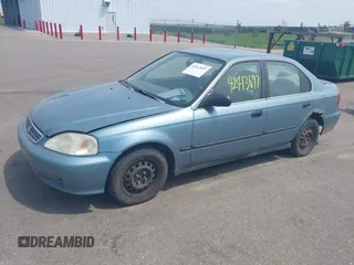 1999 Honda Civic LX z VIN 1HGEJ6678XL018332, wystawiony jako IAAI lot #42413697 z przebiegiem 196 167 mil mil oraz . Historia ofert i sprzedaży dostępna na DreamBid. Obrazek 2.