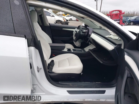 2022 Tesla Model 3 Long Range with VIN 5YJ3E1EB0NF129945, listed as a IAAI auction lot 41965531 with 59,162 mi miles and . Bid and sale history available at DreamBid. Image 5.