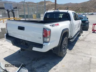 2021 Toyota Tacoma SR5 with VIN 3TMDZ5BN5MM118710, listed as a IAAI auction lot 42460278 with 60,310 mi miles and . Bid and sale history available at DreamBid. Image 4.