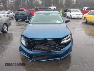 2015 Volkswagen Jetta Sedan 1.8T SE with VIN 3VWD17AJ7FM233634, listed as a IAAI auction lot 41942329 with 128,996 mi miles. Bid and sale history available at carsss.com. Image 12.