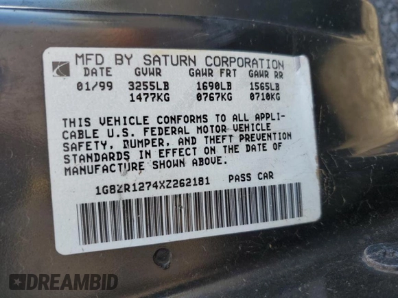 1999 Saturn SC z VIN 1G8ZR1274XZ262181, wystawiony jako Copart lot #75931774 z przebiegiem Nie podano mil oraz Szkoda całkowita • Salvage title. Historia ofert i sprzedaży dostępna na DreamBid. Obrazek 12.