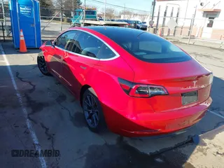 2020 Tesla Model 3 Long Range with VIN 5YJ3E1EB4LF668470, listed as a IAAI auction lot 41743651 with 151,957 mi miles. Bid and sale history available at carsss.com. Image 3.