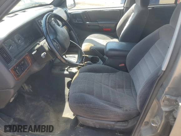 1997 Jeep Grand Cherokee Laredo z VIN 1J4GZ58S6VC636803, wystawiony jako Copart lot #59977115 z przebiegiem Nie podano mil oraz Szkoda całkowita • Salvage title. Historia ofert i sprzedaży dostępna na DreamBid. Obrazek 7.