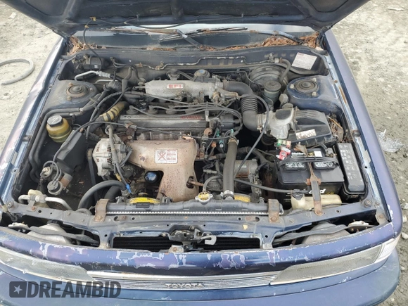 1989 Toyota Camry z VIN 4T1SV22E0KU032677, wystawiony jako Copart lot #46308555 z przebiegiem 993 896 mil mil oraz Czysty tytuł • Clean title. Historia ofert i sprzedaży dostępna na DreamBid. Obrazek 11.