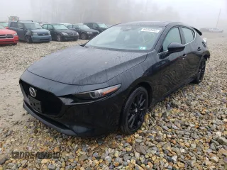 2021 Mazda Mazda3 Hatchback Premium with VIN JM1BPBML4M1402317, listed as a Copart auction lot 64393482 with 8,016 mi miles. Bid and sale history available at carsss.com. Image 2.