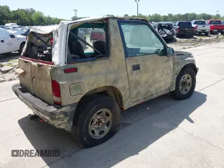 1995 Chevrolet Tracker z VIN 2CNBJ1869S6911342, wystawiony jako IAAI lot #42265392 z przebiegiem 121 944 mil mil oraz . Historia ofert i sprzedaży dostępna na DreamBid. Obrazek 4.
