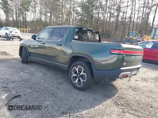 2022 Rivian R1T Adventure z VIN 7FCTGAAA8NN015369, wystawiony jako IAAI lot #41407842 z przebiegiem 22 507 mil mil oraz . Historia ofert i sprzedaży dostępna na DreamBid. Obrazek 3.
