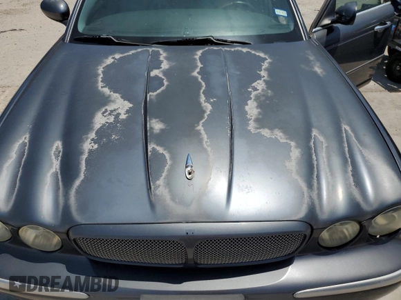 2004 Jaguar XJ R z VIN SAJWA73B64TG18784, wystawiony jako Copart lot #81254734 z przebiegiem Nie podano mil oraz Czysty tytuł • Clean title. Historia ofert i sprzedaży dostępna na DreamBid. Obrazek 11.