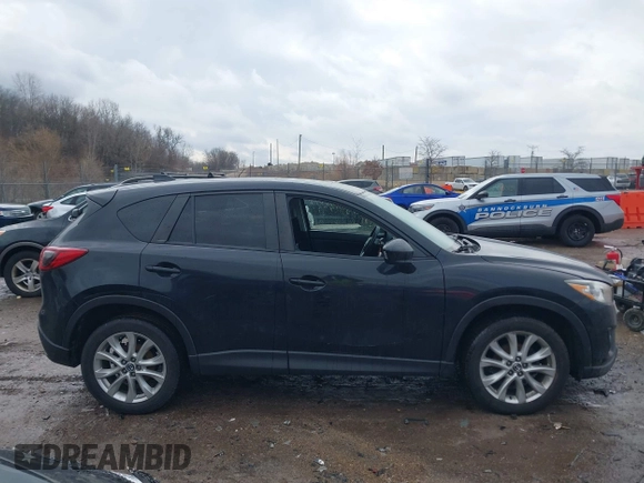 2014 Mazda CX-5 Grand Touring with VIN JM3KE4DY5E0373731, listed as a IAAI auction lot 41517852 with 148,414 mi miles. Bid and sale history available at carsss.com. Image 13.