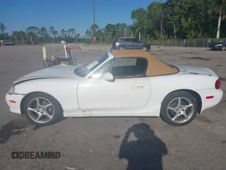 2003 Mazda MX-5 Miata Cloth z VIN JM1NB353730312566, wystawiony jako IAAI lot #41782864 z przebiegiem Nie podano mil oraz . Historia ofert i sprzedaży dostępna na DreamBid. Obrazek 14.