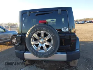 2014 Jeep Wrangler Unlimited Sahara with VIN 1C4BJWEG7EL322316, listed as a IAAI auction lot 41059508 with 144,662 mi miles. Bid and sale history available at carsss.com. Image 16.