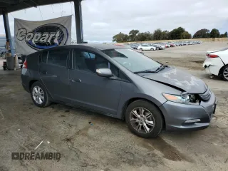 2011 Honda Insight EX with VIN JHMZE2H77BS006079, listed as a Copart auction lot 63873985 with 134,159 mi miles and Salvage title. Bid and sale history available at DreamBid. Image 4.