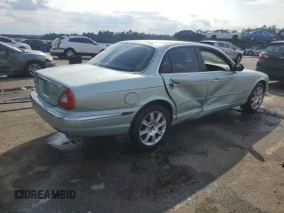 2004 Jaguar XJ with VIN SAJWA71C94SG24466, listed as a Copart auction lot 46610995 with 173,570 mi miles and Salvage Title. Bid and sale history available at carsss.com. Image 3.