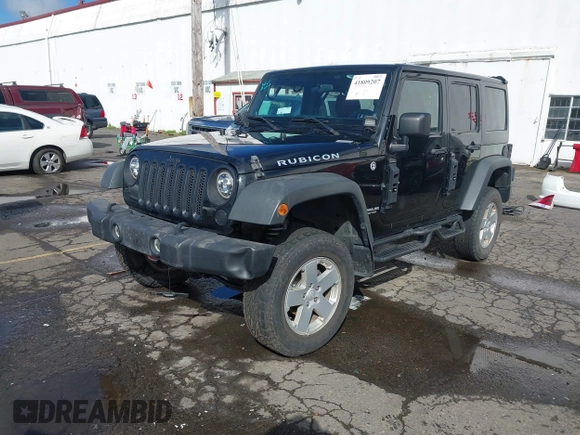 2011 Jeep Wrangler Unlimited Rubicon with VIN 1J4BA6H13BL513311, listed as a IAAI auction lot 41809207 with 124,716 mi miles and . Bid and sale history available at DreamBid. Image 17.