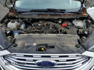 2020 Ford Edge SEL z VIN 2FMPK3J90LBB01559, wystawiony jako Copart lot #61365305 z przebiegiem 120 050 mil mil oraz Czysty tytuł • Clean title. Historia ofert i sprzedaży dostępna na DreamBid. Obrazek 12.