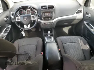 2013 Dodge Journey American Value with VIN 3C4PDCAB6DT709996, listed as a Copart auction lot 52362635 with 104,808 mi miles and Salvage Title. Bid and sale history available at DreamBid. Image 8.