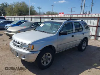 2001 Isuzu Rodeo S with VIN 4S2DM58WX14352481, listed as a IAAI auction lot 41796652 with 162,696 mi miles and . Bid and sale history available at DreamBid. Image 2.