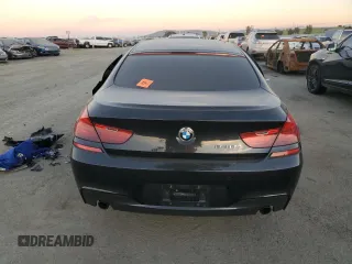 2015 BMW 6 Series 640i z VIN WBA6A0C59FD318390, wystawiony jako Copart lot #87831165 z przebiegiem Nie podano mil oraz Szkoda całkowita • Salvage title. Historia ofert i sprzedaży dostępna na DreamBid. Obrazek 6.