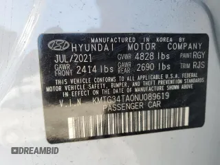 2022 Genesis G70 2.0T z VIN KMTG34TA0NU089619, wystawiony jako Copart lot #52154495 z przebiegiem 70 890 mil mil oraz Szkody całkowita. Historia ofert i sprzedaży dostępna na DreamBid. Obrazek 15.