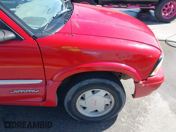 1998 GMC Jimmy SL z VIN 1GKCS13W2W2535684, wystawiony jako IAAI lot #41789456 z przebiegiem 211 201 mil mil oraz . Historia ofert i sprzedaży dostępna na DreamBid. Obrazek 13.
