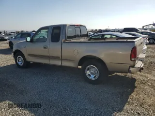 2002 Ford F-150 XL z VIN 1FTRX17232KC51909, wystawiony jako Copart lot #62081725 z przebiegiem Nie podano mil oraz Czysty tytuł • Clean title. Historia ofert i sprzedaży dostępna na DreamBid. Obrazek 2.