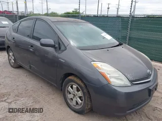 2007 Toyota Prius z VIN JTDKB20U673216476, wystawiony jako IAAI lot #42128960 z przebiegiem 182 912 mil mil oraz . Historia ofert i sprzedaży dostępna na DreamBid. Obrazek 1.