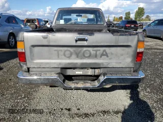 1989 Toyota Pickup DLX z VIN JT4VN13D0K0001910, wystawiony jako Copart lot #77413274 z przebiegiem 311 223 mil mil oraz Szkoda całkowita • Salvage title. Historia ofert i sprzedaży dostępna na DreamBid. Obrazek 6.