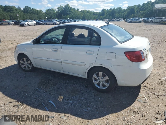 2010 Kia Rio LX with VIN KNADH4A31A6635895, listed as a Copart auction lot 61308434 with 209,016 mi miles and Salvage Title. Bid and sale history available at carsss.com. Image 2.