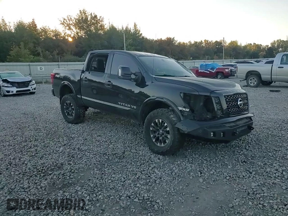 2019 Nissan Titan Pro-4X z VIN 1N6AA1E53KN525603, wystawiony jako Copart lot #77336264 z przebiegiem 64 507 mil mil oraz Szkoda całkowita • Salvage title. Historia ofert i sprzedaży dostępna na DreamBid. Obrazek 11.