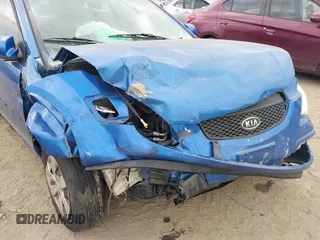 2009 Kia Rio LX with VIN KNADE243296494243, listed as a IAAI auction lot 41307888 with 133,487 mi miles. Bid and sale history available at carsss.com. Image 6.