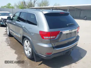 2013 Jeep Grand Cherokee Overland with VIN 1C4RJFCG2DC611877, listed as a IAAI auction lot 41910800 with 151,457 mi miles. Bid and sale history available at carsss.com. Image 3.