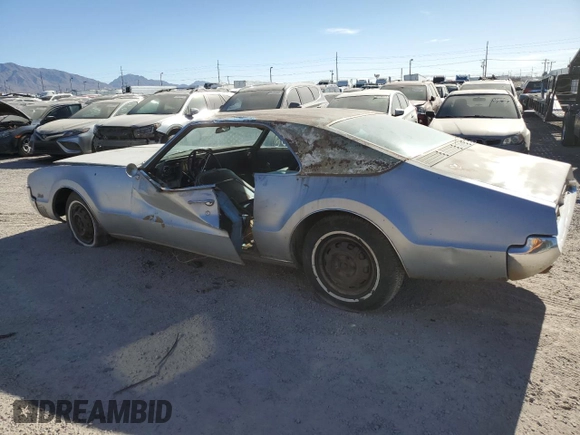 1967 Oldsmobile Toronado with VIN 396877N610043, listed as a Copart auction lot 79516854 with 242,595 mi miles and Clean Title. Bid and sale history available at DreamBid. Image 2.