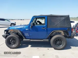 2010 Jeep Wrangler Sport with VIN 1J4AA2D11AL117404, listed as a IAAI auction lot 42012340 with 266,310 mi miles and . Bid and sale history available at carsss.com. Image 14.