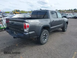 2020 Toyota Tacoma SR5 with VIN 3TMCZ5AN7LM321061, listed as a IAAI auction lot 41985533 with 32,111 mi miles and . Bid and sale history available at DreamBid. Image 4.