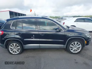 2012 Volkswagen Tiguan SE z VIN WVGAV7AX7CW504391, wystawiony jako IAAI lot #42240604 z przebiegiem 180 330 mil mil oraz . Historia ofert i sprzedaży dostępna na DreamBid. Obrazek 13.