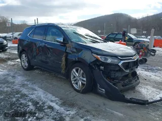 2018 Chevrolet Equinox Premier with VIN 3GNAXNEX0JS614356, listed as a IAAI auction lot 41624067 with 128,650 mi miles. Bid and sale history available at carsss.com. Image 1.