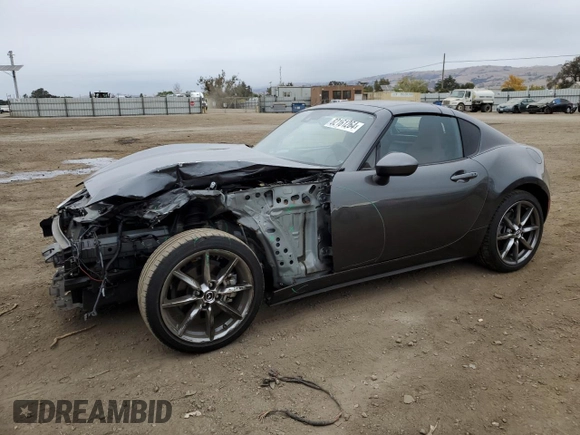 2022 Mazda MX-5 Miata Grand Touring z VIN JM1NDAM77N0501546, wystawiony jako Copart lot #82161264 z przebiegiem 12 245 mil mil oraz Szkoda całkowita • Salvage title. Historia ofert i sprzedaży dostępna na DreamBid. Obrazek 1.