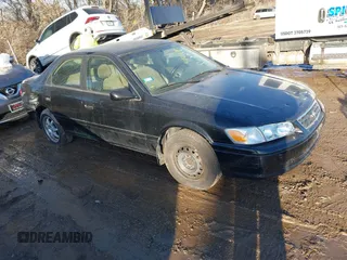 2001 Toyota Camry CE with VIN JT2BG22K210598164, listed as a IAAI auction lot 41457913 with 129,198 mi miles. Bid and sale history available at carsss.com. Image 1.