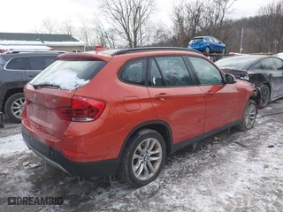 2015 BMW X1 xDrive28i with VIN WBAVL1C51FVY33650, listed as a IAAI auction lot 41400985 with 132,484 mi miles. Bid and sale history available at carsss.com. Image 4.