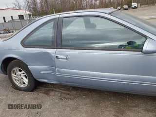 1997 Ford Thunderbird LX with VIN 1FALP62W2VH105702, listed as a IAAI auction lot 41713980 with 90,775 mi miles and . Bid and sale history available at DreamBid. Image 6.