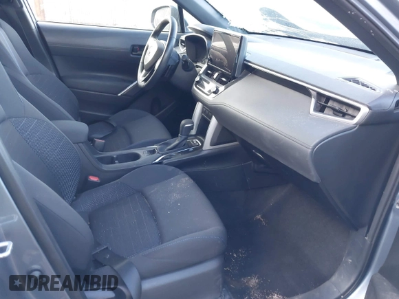 2023 Toyota Corolla Cross Hybrid S with VIN 7MUFBABG3PV005338, listed as a IAAI auction lot 41633311 with 32,082 mi miles and . Bid and sale history available at DreamBid. Image 5.