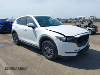 2017 Mazda CX-5 Touring z VIN JM3KFBCL7H0201342, wystawiony jako IAAI lot #42148004 z przebiegiem 166 595 mil mil oraz . Historia ofert i sprzedaży dostępna na DreamBid. Obrazek 1.
