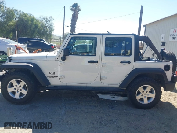 2007 Jeep Wrangler Unlimited X with VIN 1J4GB39147L133997, listed as a IAAI auction lot 41676009 with 110,849 mi miles and . Bid and sale history available at DreamBid. Image 14.