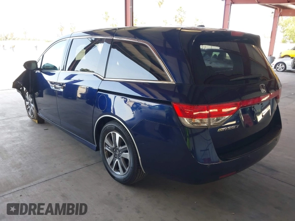 2017 Honda Odyssey Touring with VIN 5FNRL5H90HB017215, listed as a IAAI auction lot 42574528 with 61,386 mi miles and . Bid and sale history available at DreamBid. Image 3.