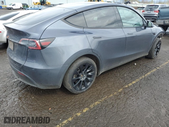 2023 Tesla Model Y Long Range z VIN 7SAYGDEE1PF937867, wystawiony jako Copart lot #51615195 z przebiegiem 88 912 mil mil oraz Szkoda całkowita • Salvage title. Historia ofert i sprzedaży dostępna na DreamBid. Obrazek 3.