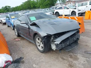 2021 Ford Mustang EcoBoost with VIN 1FA6P8TH9M5133781, listed as a IAAI auction lot 42158034 with 31,648 mi miles. Bid and sale history available at carsss.com. Image 1.