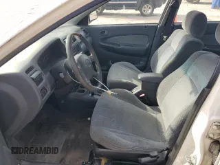 1998 Mazda Protege DX z VIN JM1BC1416W0194406, wystawiony jako Copart lot #44535955 z przebiegiem 312 942 mil mil oraz Szkoda całkowita • Salvage title. Historia ofert i sprzedaży dostępna na DreamBid. Obrazek 7.